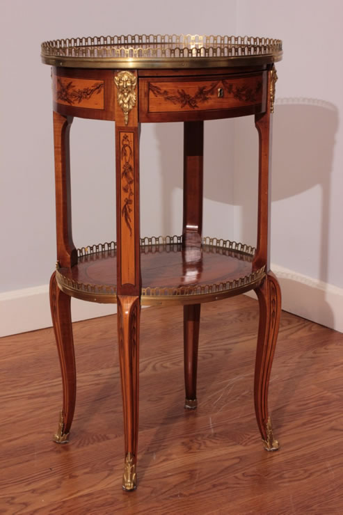 Pair of oval transitional marquetry tables signed Topino