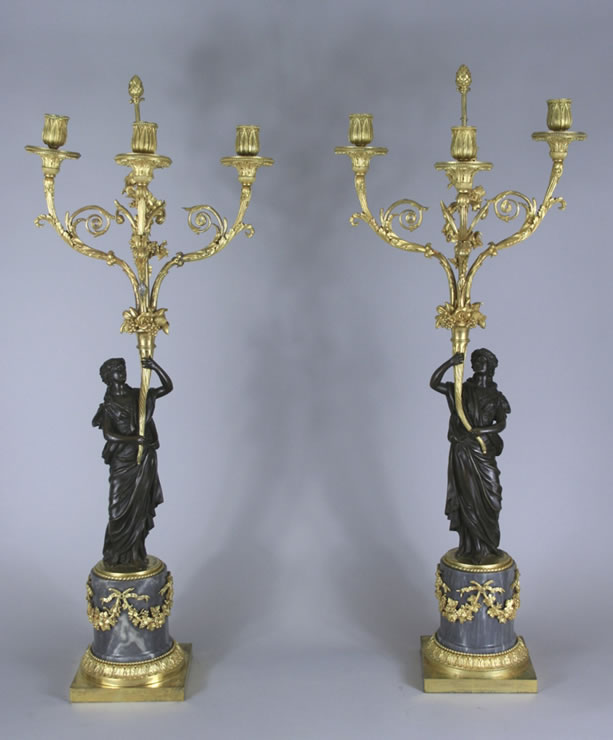 Pair three light candelabra with patinated figures  
