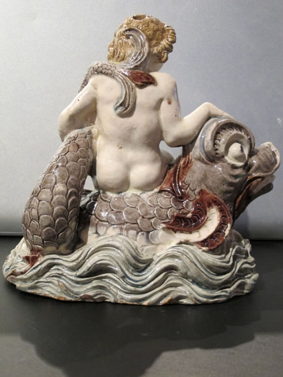 Fontainebleau glazed figure of a boy on a dolphin