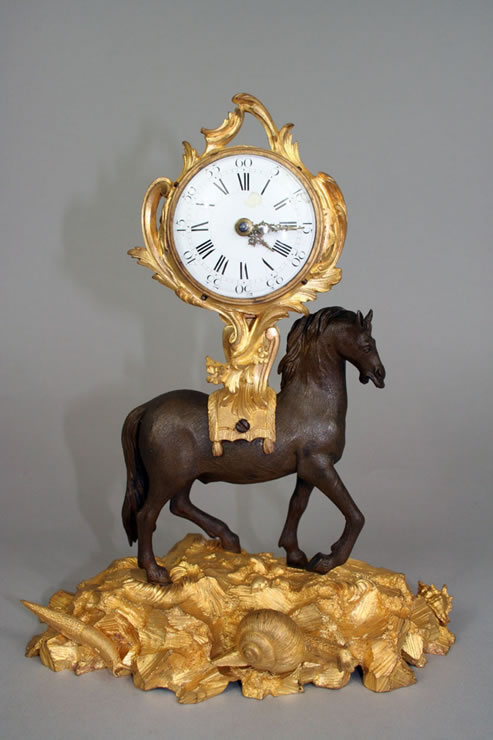 Early Louis XV clock supported by a horse.