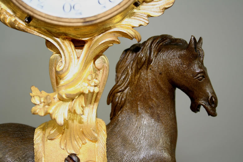 Early Louis XV clock supported by a horse.