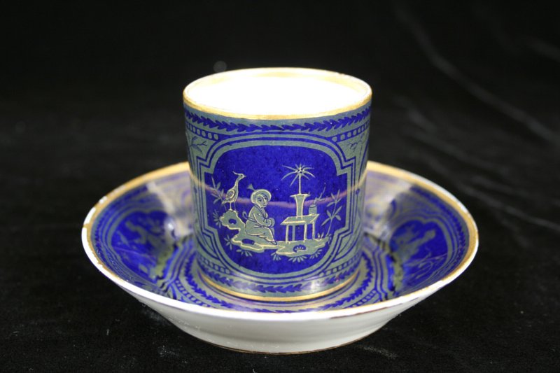Svres chinoiserie and arabesque decorated coffee can and saucer (goblet litron et soucoupe.)