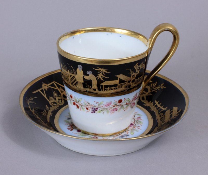 Sevres Empire black ground Chinoiserie cup and saucer