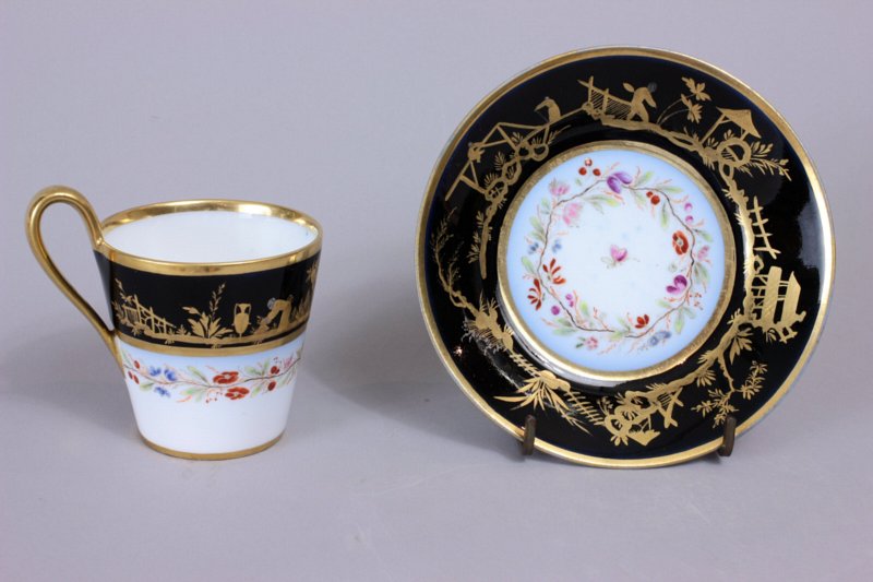 Sevres Empire black ground Chinoiserie cup and saucer