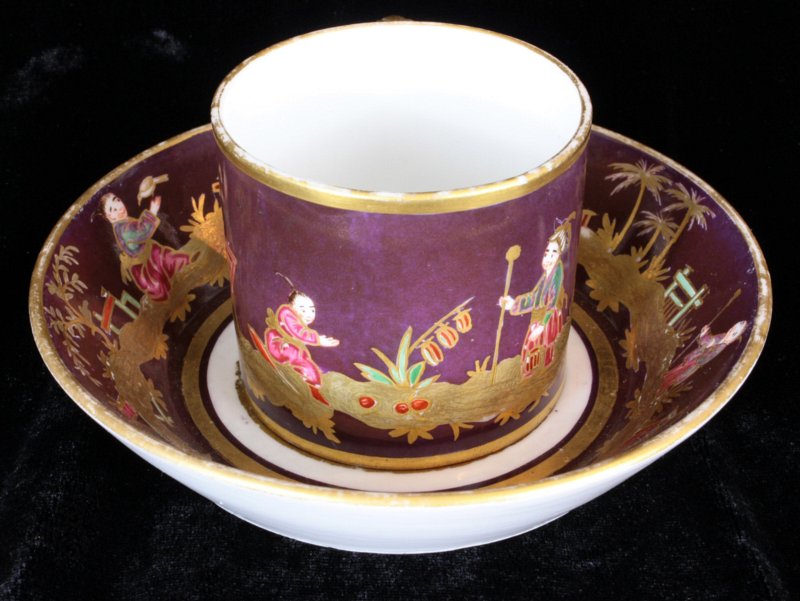 Small Sevres Chinoiserie purple ground cup and saucer