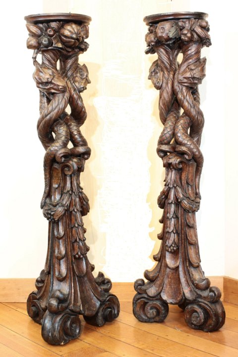 Italian baroque walnut pedestals symbolizing the Agathodaemon