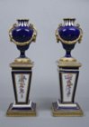 A pair of Svres miniature urns 