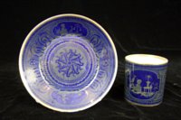 Svres chinoiserie and arabesque decorated coffee can and saucer (goblet litron et soucoupe.)